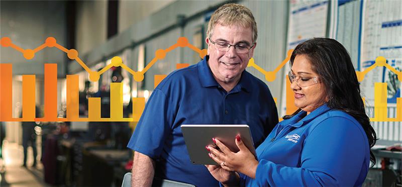 Consumers Energy working helping a small business owner